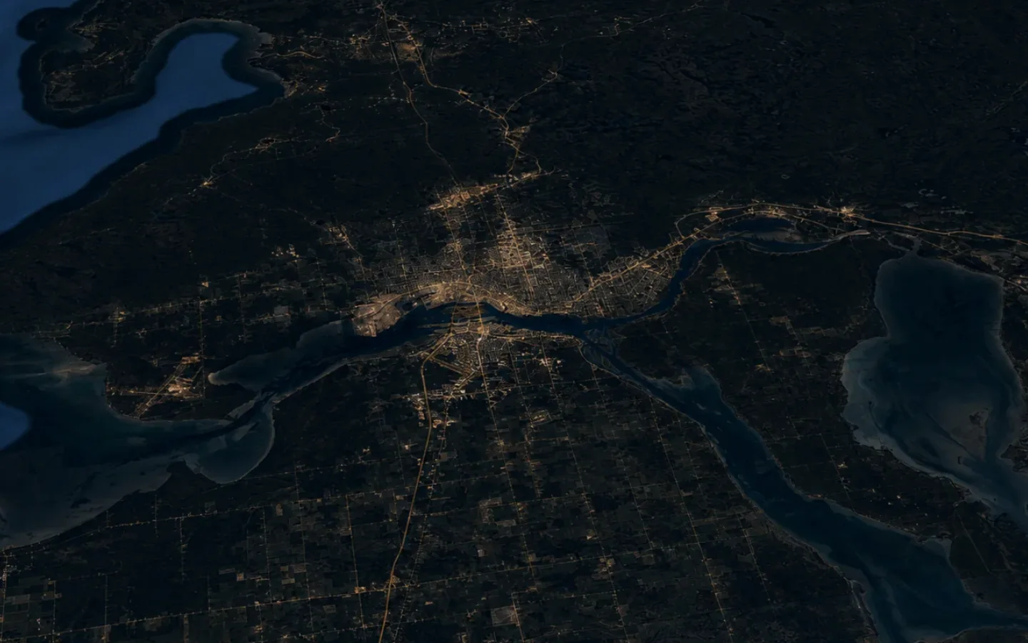 Dark aerial map of Sault Ste. Marie and the St. Marys River